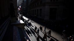 Pedestrians walk along Wall Street near the New York Stock Exchange (NYSE) in New York, U.S., on Monday, Oct. 31, 2016. U.S. stocks rose from a six-week low amid an increase in deal activity as traders assessed the outlook for the presidential election and interest rates in the world's largest economy. Photographer: Michael Nagle/Bloomberg via Getty Images