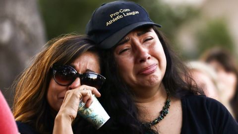  People embrace at a vigil for victims of the mass shooting at the Gilroy Garlic Festival on July 29, 2019 in Gilroy, California. 