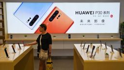 People browse for items in a Huawei store in Shanghai on May 24, 2019. 