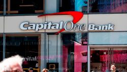 People walk past a branch of the Capital One Bank on April 17, 2019 in New York City. (Photo by Johannes EISELE / AFP)        (Photo credit should read JOHANNES EISELE/AFP/Getty Images)