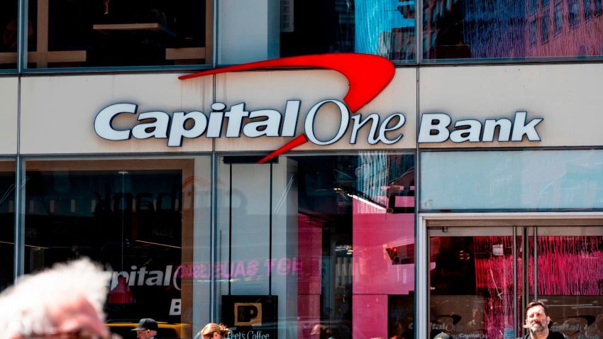 People walk past a branch of the Capital One Bank on April 17, 2019 in New York City. (Photo by Johannes EISELE / AFP)        (Photo credit should read JOHANNES EISELE/AFP/Getty Images)