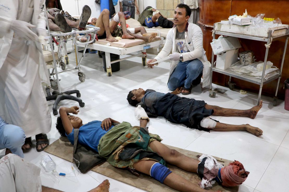 People injured by an explosion in a market in Yemen's Saada province receive medical attention at the local Al Jomhouri hospital.