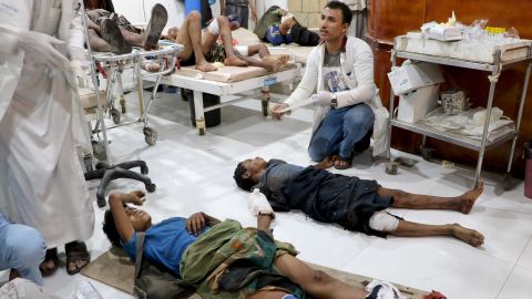 People injured by an explosion in a market in Yemen's Saada province receive medical attention at the local Al Jomhouri hospital.