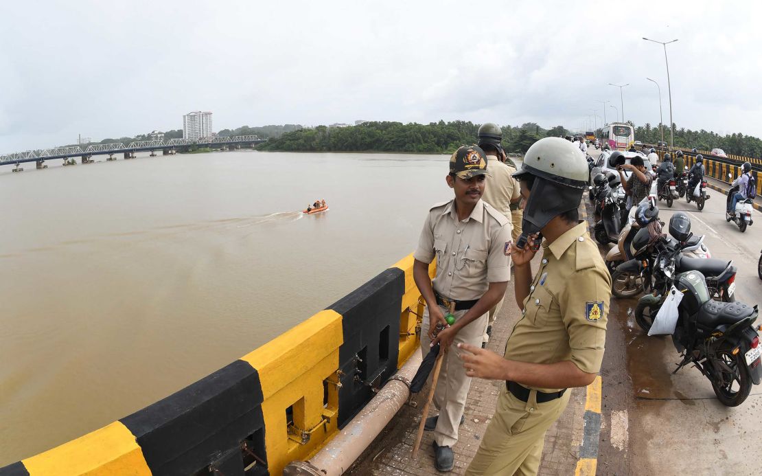 Police at the Netravati river in Mangalore, southern India, as search teams look for Indian coffee tycoon V.G. Siddhartha.