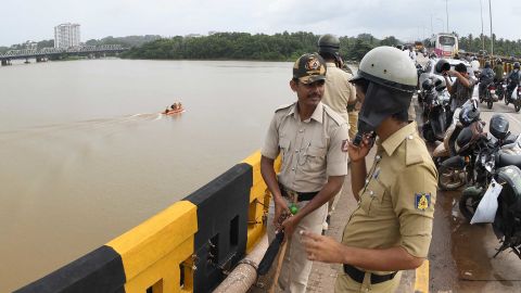 Police at the Netravati river in Mangalore, southern India, as search teams look for Indian coffee tycoon V.G. Siddhartha.