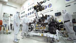 The Mars 2020 rover's 7-foot-long arm simulates a bicep curl with an 88 pound sensor-laden turret.