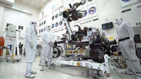 The Mars 2020 rover's 7-foot-long arm simulates a bicep curl with an 88-pound sensor-laden turret.