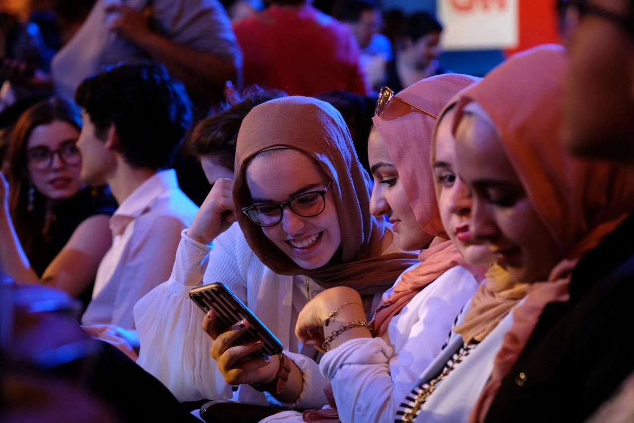 Audience members wait for the debate to begin on Tuesday.