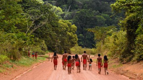 Brazilian Waiapi walk on the road of the Waiapi indigenous reserve, at Pinoty village in Amapa state in Brazil.