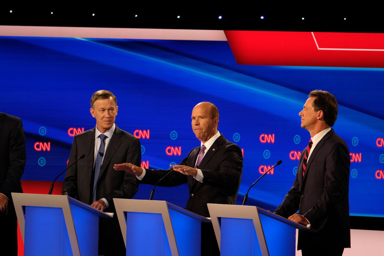 Delaney, center, speaks during the first hour of Tuesday's debate. The former congressman from Maryland came out swinging against Sanders and "Medicare for All," blasting it as a political loser. Sanders, after listening to the attack, replied simply: "You're wrong."