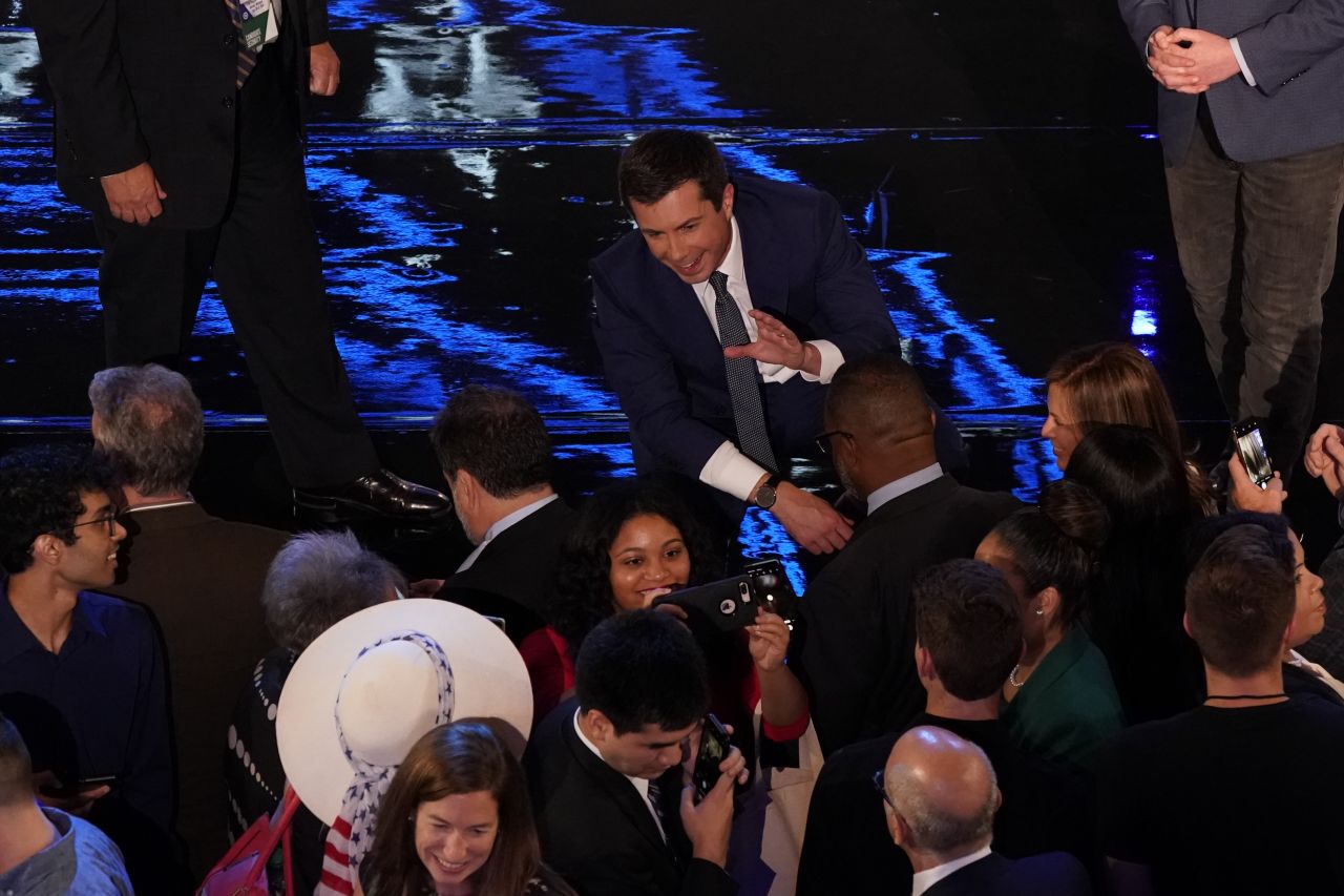 Buttigieg poses for a picture with a supporter following Tuesday's debate.