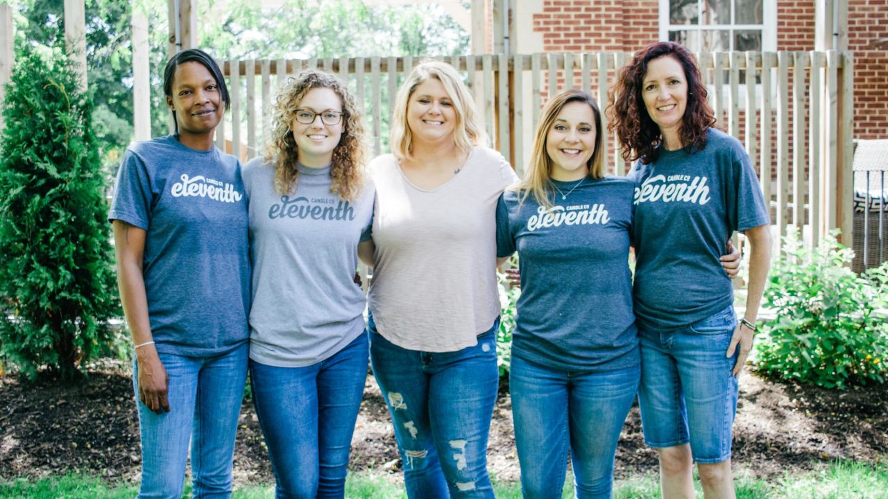 Amber Runyon [middle], founder of Eleventh Candle, with some of her employees.
