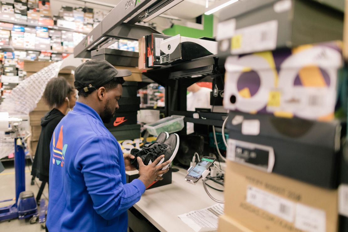 A StockX employee processing a pair of sneakers. The company started with six employees and has since grown to a headcount of 800.
