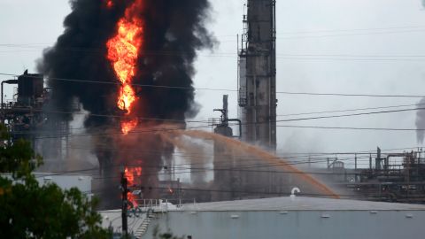 Flames and smoke rise from the ExxonMobil complex in Baytown, Texas.