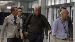 Ethan Elder, center, father of Finnegan Lee Elder, arrives at Fiumicino Rome Airport Wednesday, July 31, 2019. Finnegan Lee Elder, 19, is suspected of being the one who stabbed Carabinieri officer Cerciello Rega and is detained in Rome with Gabriel Christian Natale-Hjorth, 18, who is suspected of assaulting another officer. (AP Photo/Gregorio Borgia)