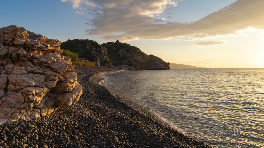 <strong>Mavra Volia, Chios: </strong>The name Mavra Volia translates to black pebbles, which is taken from the volcanic stones that cover its dramatic curve.