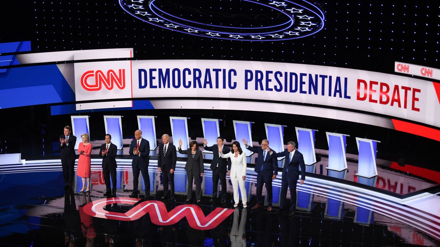 Democratic presidential candidates wave from the stage ahead of the second round of the second Democratic primary debate of the 2020 presidential campaign season hosted by CNN at the Fox Theatre in Detroit, Michigan on July 31, 2019. 