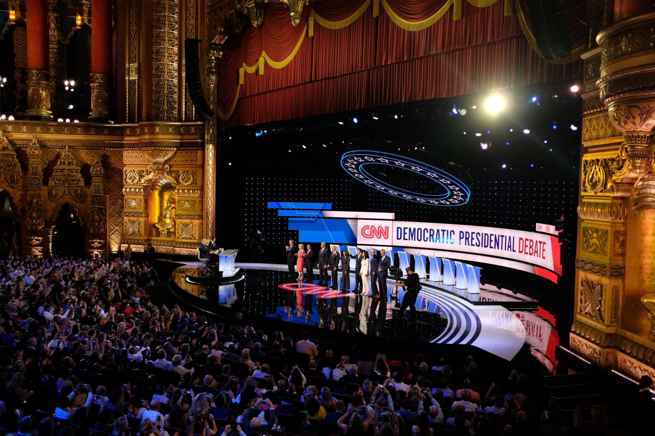 The candidates pose for photos after being introduced on stage.