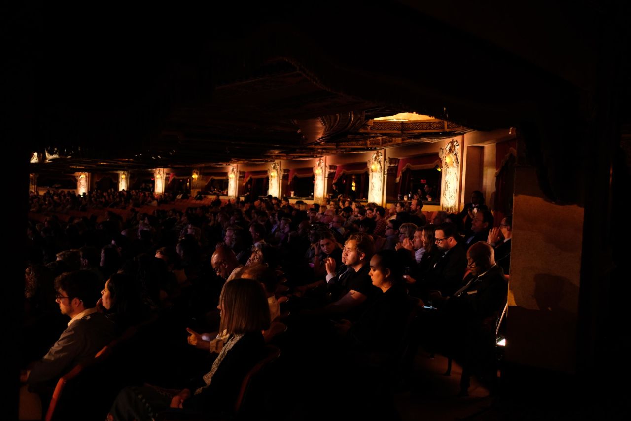 Audience members watch the debate from inside the Fox Theatre.