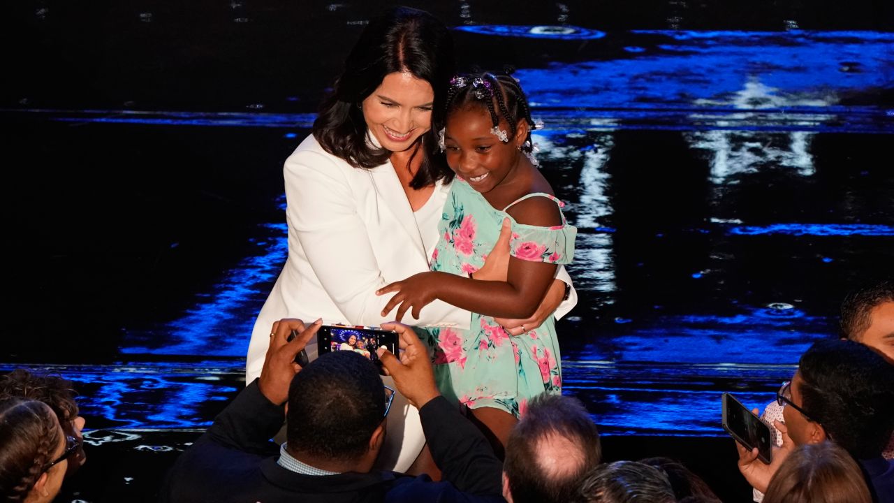Gabbard poses for a picture after the debate on Wednesday.