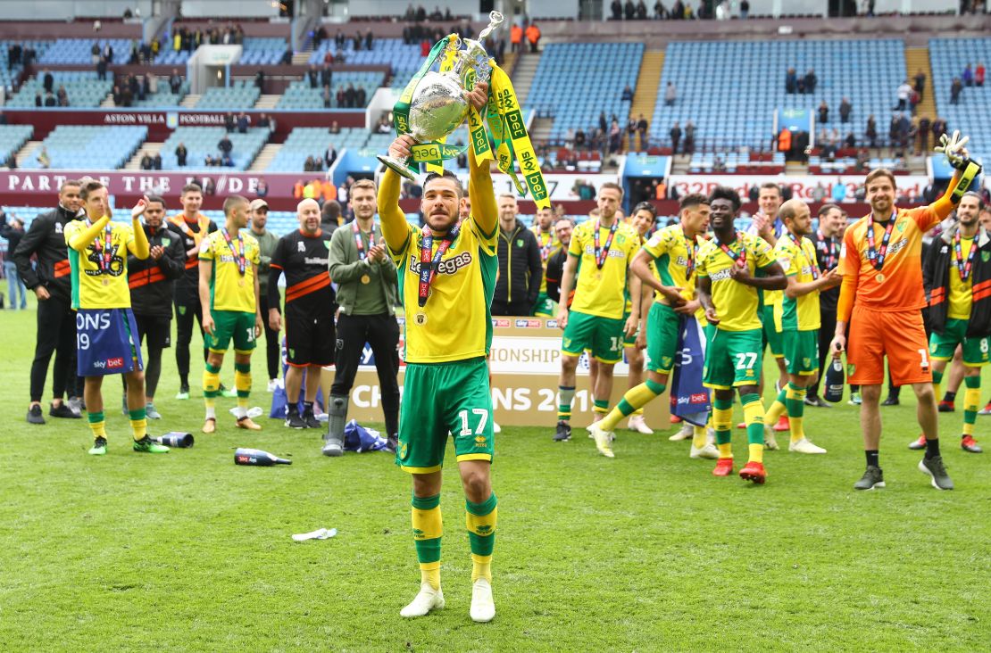Emi Buendia of Norwich City lifts the Championship trophy in celebration.