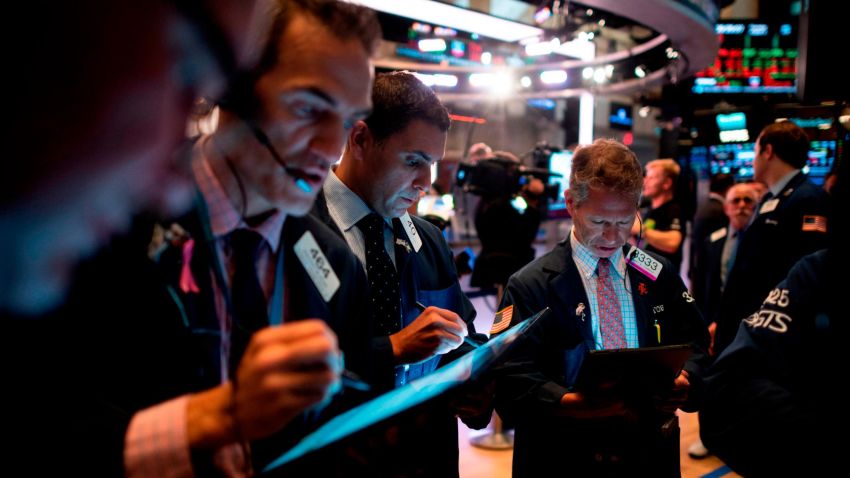 Traders work after the opening bell at the New York Stock Exchange (NYSE) on Wall Street, August 1, 2019, in New York City. - Wall Street stocks bounced on August 1, 2019, winning back some of the losses suffered in the prior session following the Federal Reserve's first interest rate cut in more than a decade. Major indices dropped more than one percent in the wake of the rate decision on July 31, which was followed by a confusing news conference by Fed Chair Jerome Powell who tried to justify the move and explain the implications for monetary policy in coming months. (Photo by Johannes EISELE / AFP)        (Photo credit should read JOHANNES EISELE/AFP/Getty Images)