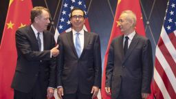 US Trade Representative Robert Lighthizer (L) gestures towards US Treasury Secretary Steven Mnuchin (C) as he chats with Chinese Vice Premier Liu He (R) before they pose for a "family photo" at the Xijiao Conference Centre in Shanghai on July 31, 2019. - Chinese and US negotiators held talks in Shanghai on July 31 in a bid to bring an end to a year-long trade war, with the meeting overshadowed by a Twitter tirade from President Donald Trump. (Photo by Ng Han Guan / POOL / AFP)        (Photo credit should read NG HAN GUAN/AFP/Getty Images)