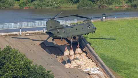 A Royal Air Force Chinook has been drafted in to help reinforce a dam in the Derbyshire town.