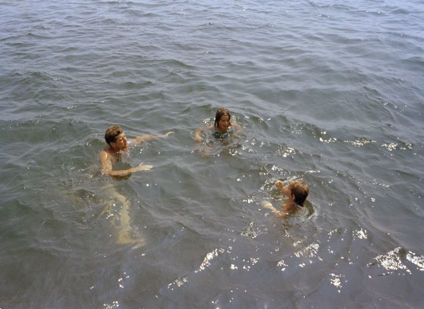 President Kennedy, left, swims with family and friends during a weekend in Hyannis Port in 1963.