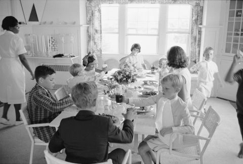 Ethel Kennedy sits with various Kennedy children in 1963, when the family was celebrating the christening of Bobby's son Chris.