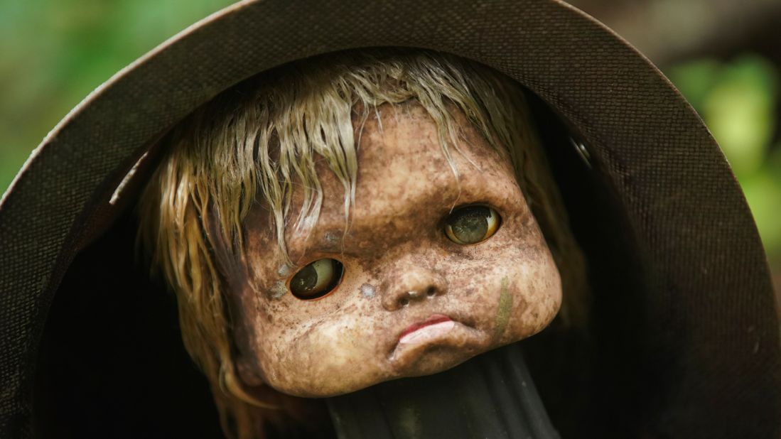 <strong>Down in the mouth:</strong> This doll's head, forced to don a metal hat, doesn't seem to be too happy about the situation. "The displays have changed a lot over time, mostly due to cherry-picking and vandalism," Slaton said.