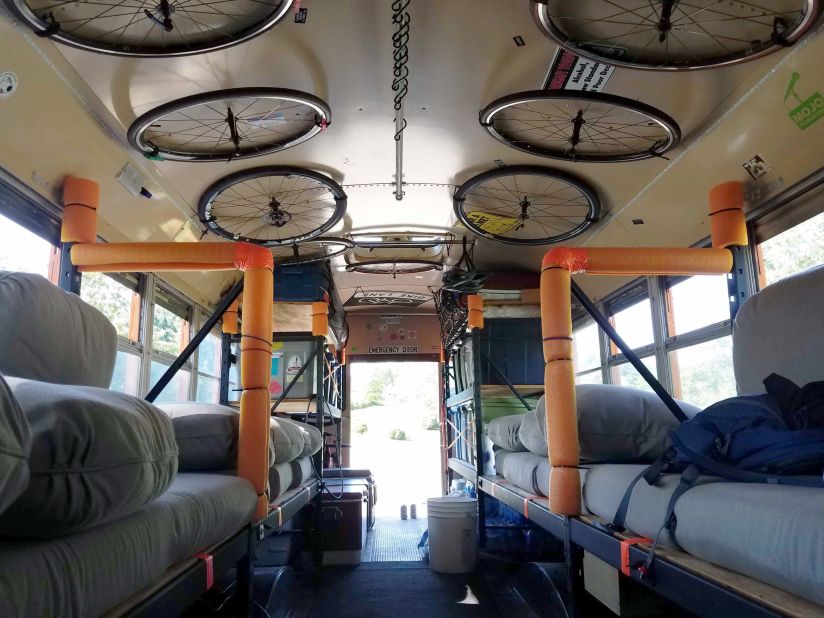 <strong>Team transport:</strong> This is one of many team buses customized to transport cycling teams and their gear. Team Wasted Potential stores the bikes on a welded support on the inside roof of the bus.
