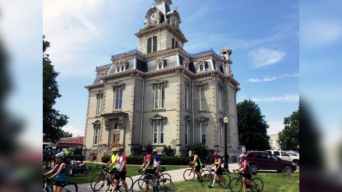 <strong>R&R: </strong>Riders take a break at the fifth day's meeting town of Bloomfield, Iowa, during RAGBRAI, on Thursday, July 25, 2019.