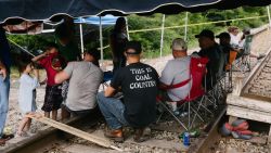 Supporters of miners sit on train tracks in Cumberland, Kentucky, U.S., on Friday, Aug. 2, 2019. The miners have been working in shifts to block railroad tracks leading to a Blackjewel mine outside since Monday afternoon, Harlan County Judge-Executive Dan Mosley said in an interview. They're demanding back pay for work done in weeks leading up to the bankruptcy, after checks issued by Blackjewel bounced or never arrived. Photographer: Meg Roussos/Bloomberg via Getty Images