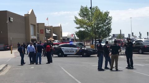 Police gather outside the Walmart at Cielo Vista Mall.