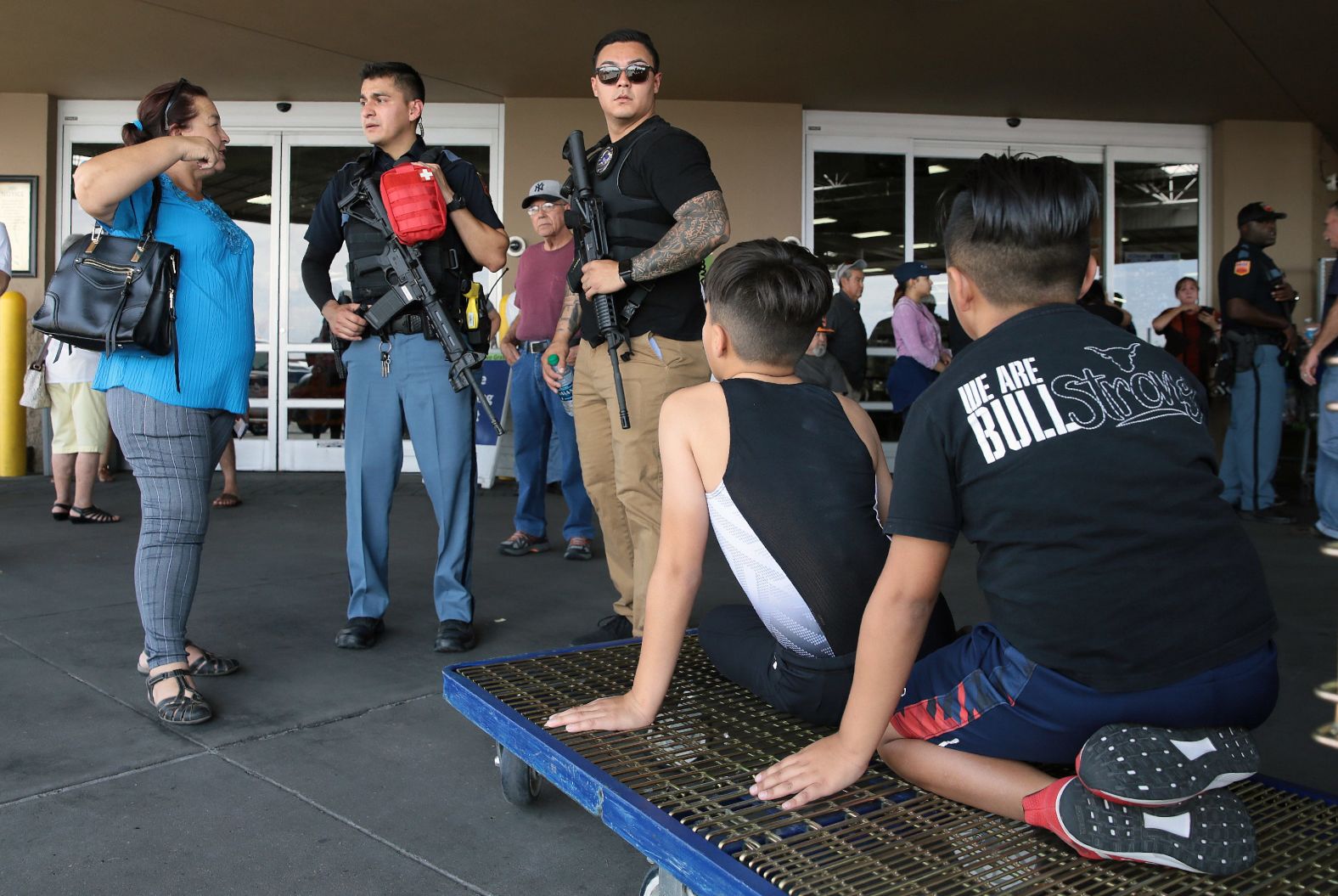 Police speak to witnesses at a nearby Sam's Club in El Paso.