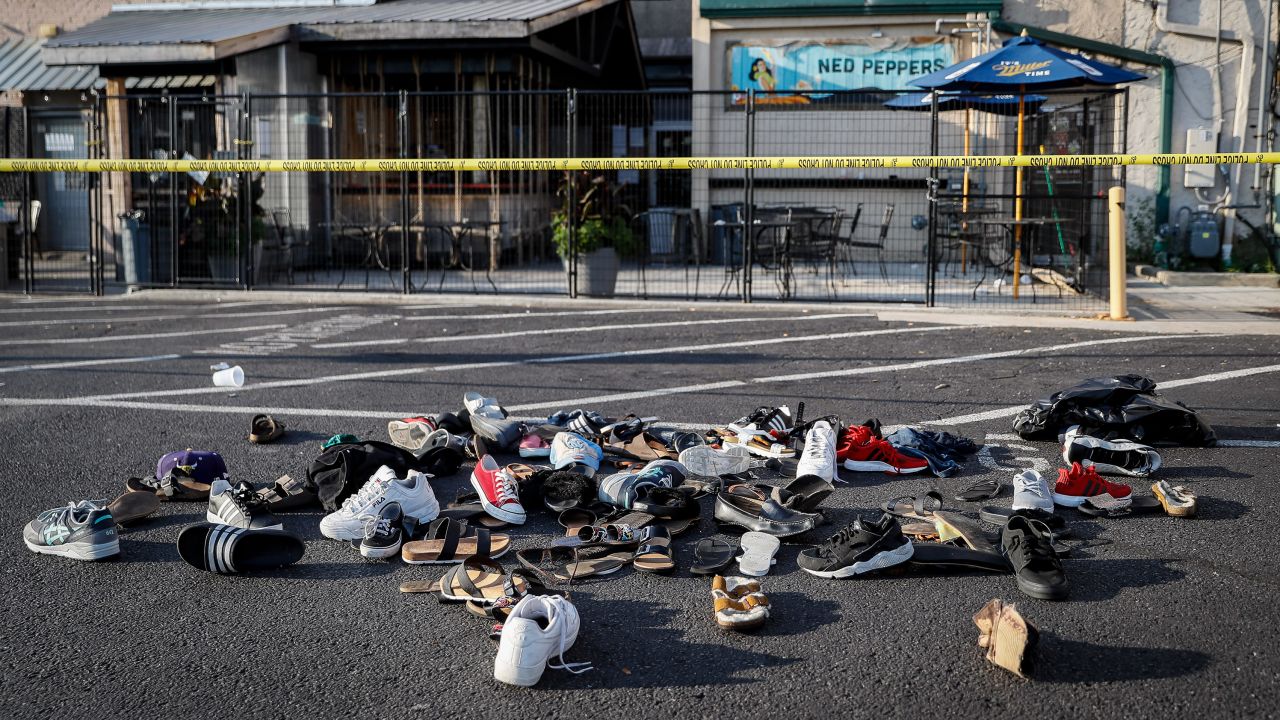 Shoes, hats and other articles of clothing are piled together outside of Ned Peppers bar in Dayton on August 4.