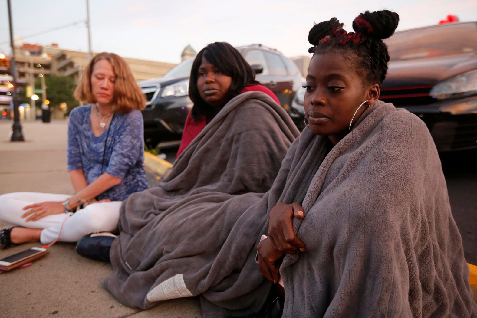 From left, Tiffany McConnell, Tanycia Leonard and Nikita Papillion recall their night in Dayton.