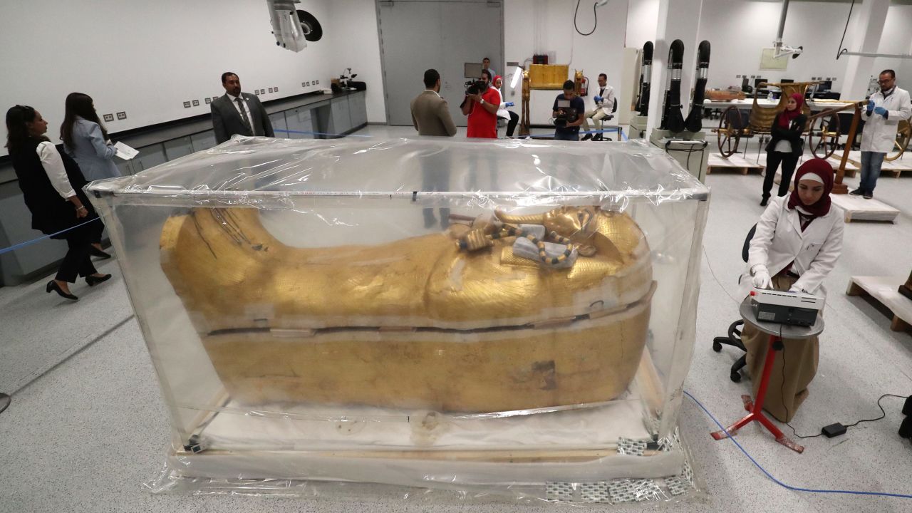 Tutankhamun's gilded coffin undergoes restoration at the conservation center in the Grand Egyptian Museum. 