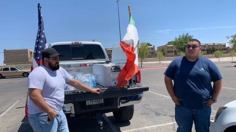 Briyan Estrada and Gabriel Gonzalez spent hours Sunday handling ice-cold water bottles to fellow El Pasoans.