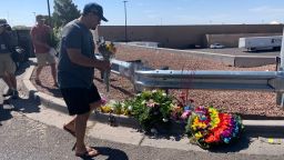 Alfredo Angcayan, 62, an Air Force veteran, brought a bouquet of flower to a growing memorial a few yards away from the Walmart store in El Paso, TX, where 20 people were killed in a shooting on August 3, 2019. 
