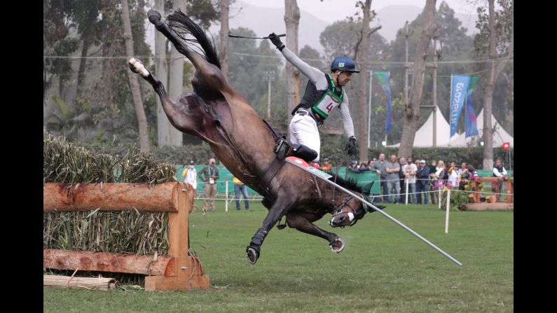 Brazil's Ruy Leme Da Fonseca Fil riding Ballypatrick SRS falls after a jump during the Pan American Games in Lima, Peru, on Saturday, August 3.