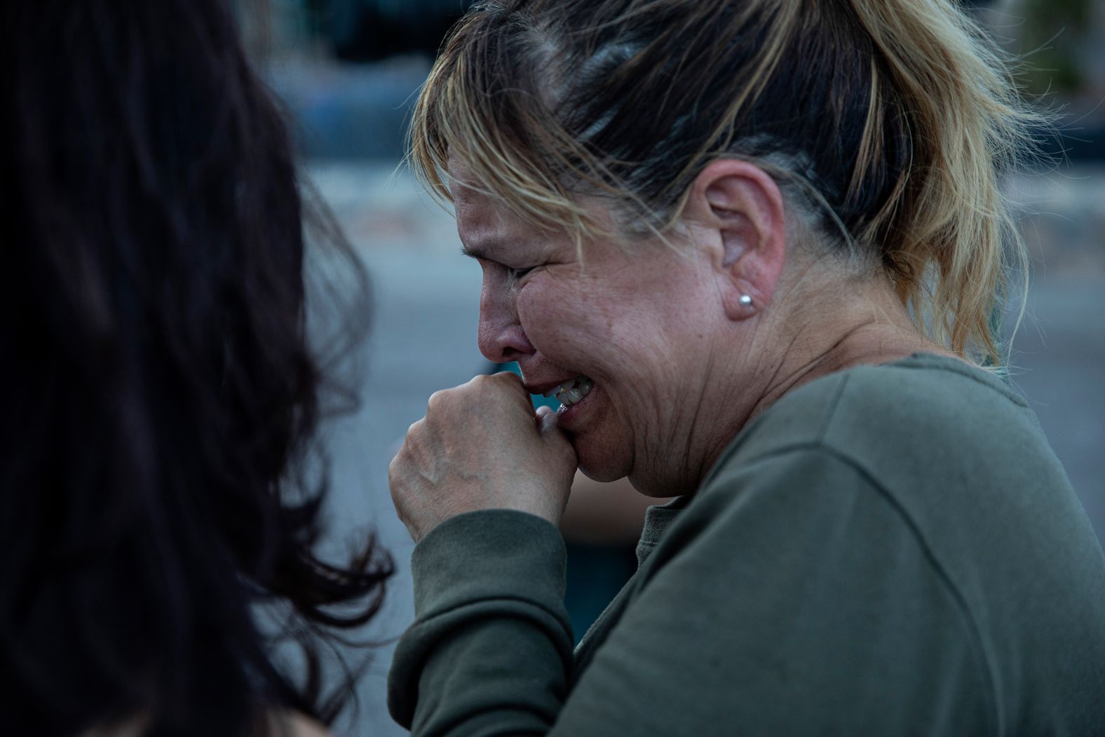 Edie Hallberg speaks to reporters near the site of the El Paso Walmart where people were killed Saturday. Hallberg's mother, Angie Englisbee, was killed in the shooting.