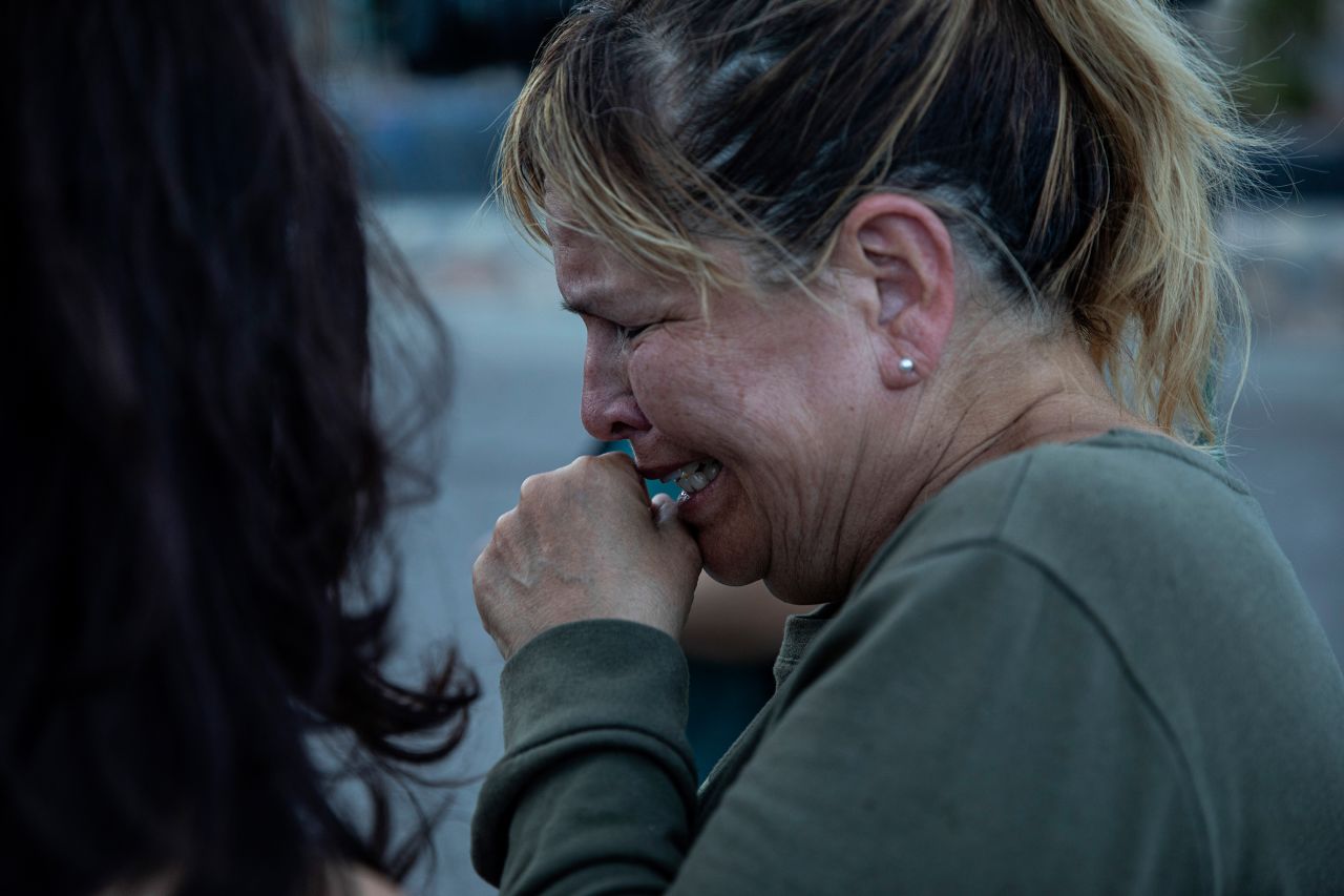 Edie Hallberg speaks to reporters near the site of the El Paso Walmart where people were killed Saturday. Hallberg's mother, Angie Englisbee, was killed in the shooting.