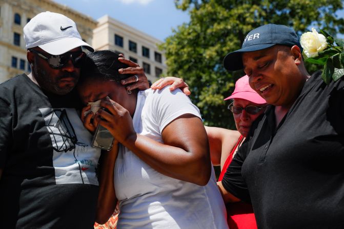 Mourners gather at a vigil in Dayton.