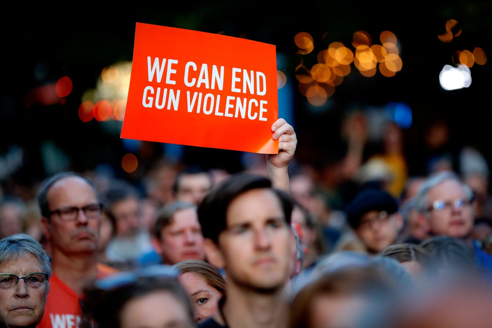 Someone holds up a sign during the vigil in Dayton.