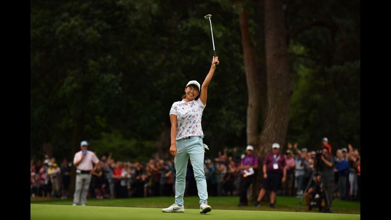 Japan's Hinako Shibuno celebrates after holing a long birdie putt on the 18th green to win on the final day of the Women's British Open golf championship at in Milton Keynes, north of London, on Sunday, August 4.