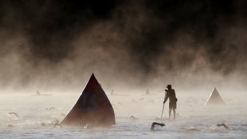 Athletes compete in the swim portion of the Ironman Canada, on Sunday, July 28 in Whistler, Canada. 