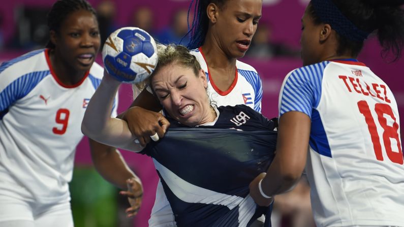 Sarah Gascon of the United States is marked by Cuban players during the Handball Women Bronze Medal Match during the Pan American Games, in Lima, Peru, on Tuesday, July 30. Cuba won the bronze medal.
