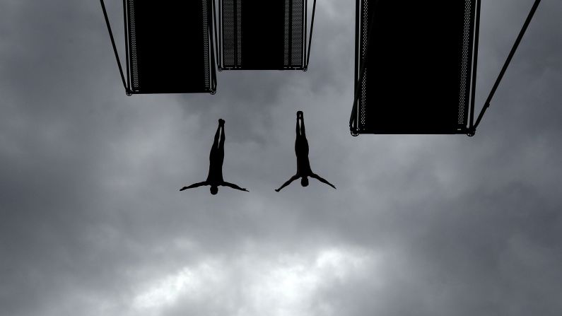 Competitors jump into water during a high diving competition near the village of Hrimezdice, Czech Republic, Friday, August 2.